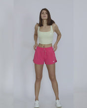 Load and play video in Gallery viewer, MW Drawstring Dolphin shorts with side pockets, and curved hem, giving you the sleek look that takes you from gym, walk to malls
